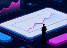 A group of business people reviewing a graph on a tablet, engaged in discussion.